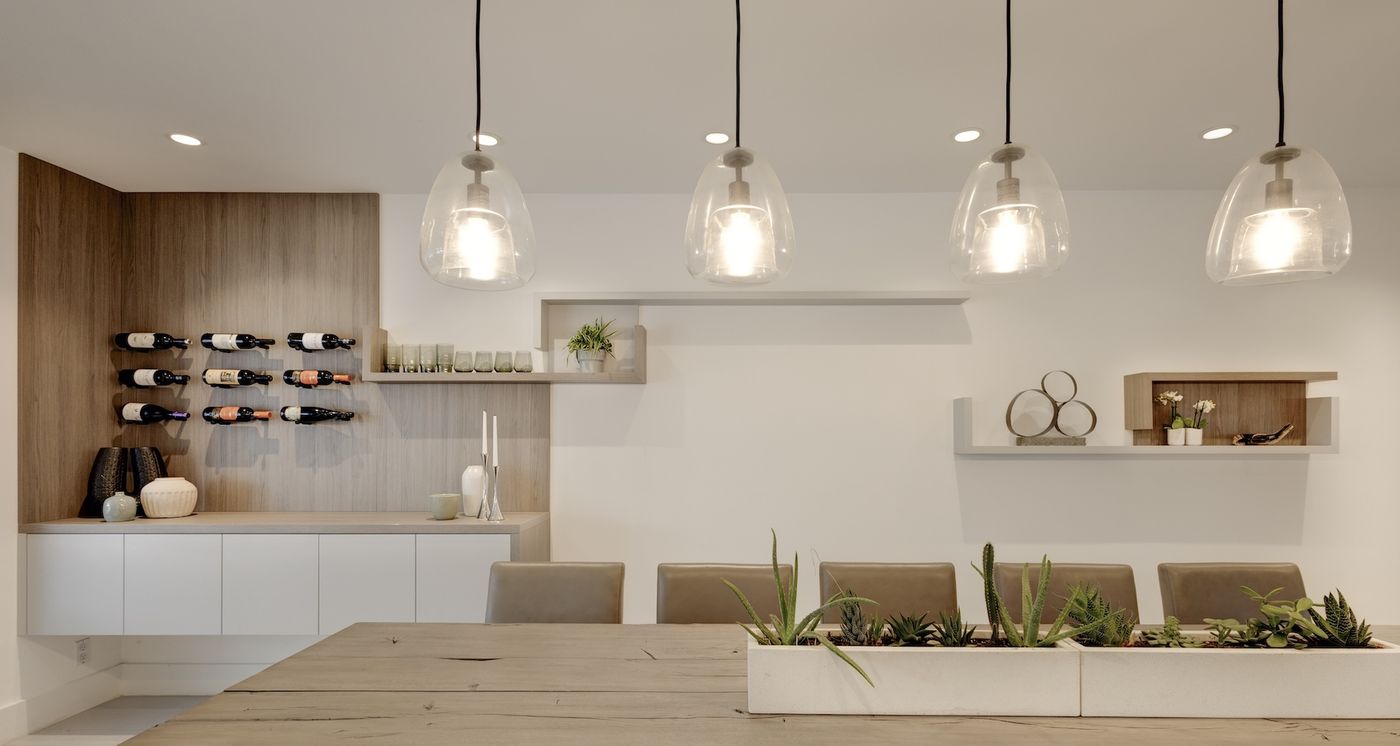 Walnut dining wall with wine display and floating shelves