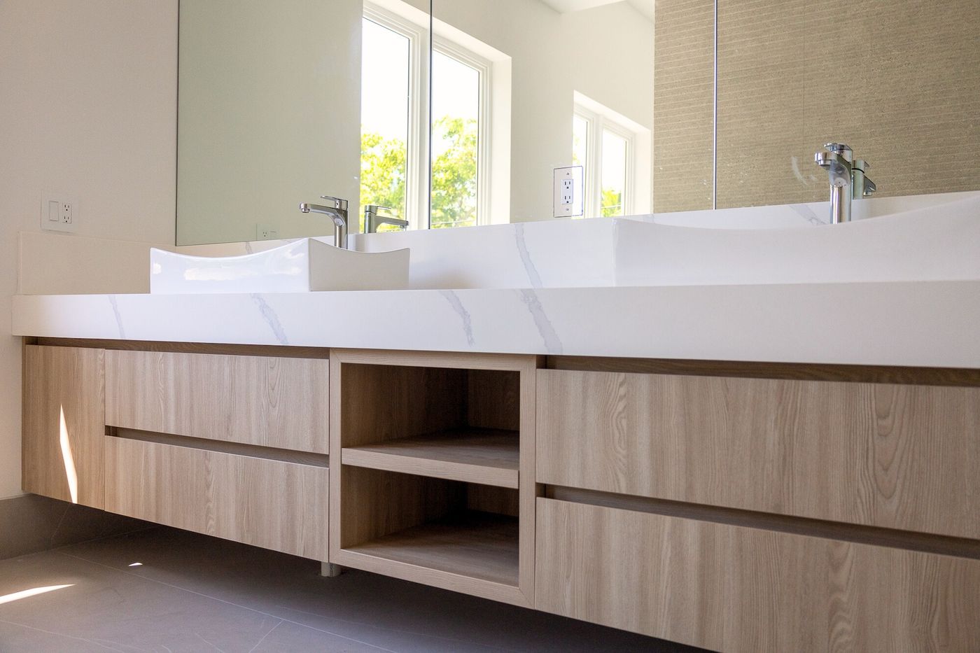 Floating oak double vanity with quartz countertop